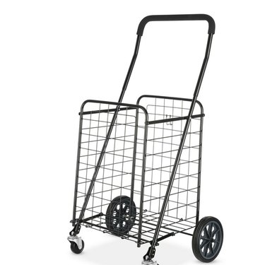 Mainstays wire shopping cart from Walmart shown on a white ground, with its adjustable handle and metal front casters clearly visible