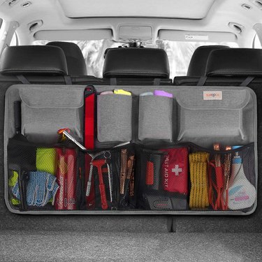 Gray trunk organizer loaded with items