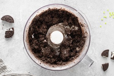 Oreo and cream cheese mixture in a food processor