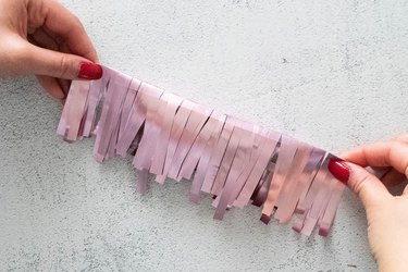 Fold pink tinsel fringe