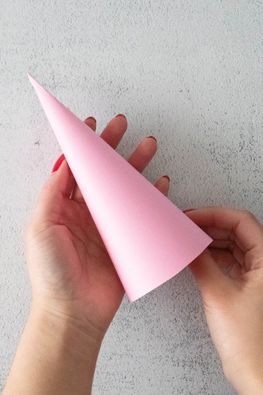 Pink cardstock cone for tinsel tree party cracker