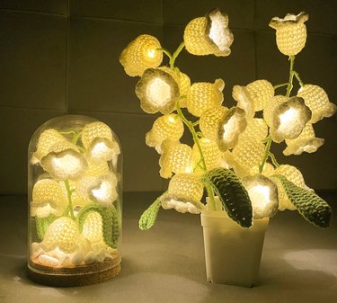 Crochet lily of the valley lamps in white and green.