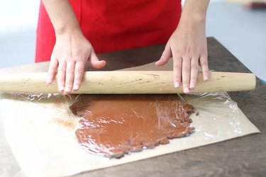 Rolling out a sheet of dough