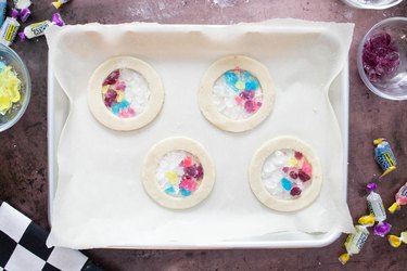 Fill center of cookies with crushed Jolly Ranchers