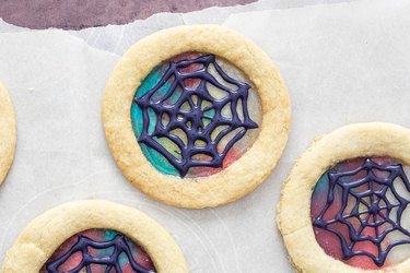 Stained glass sugar cookies with royal icing web design