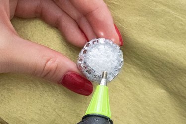 Glue rhinestones to foam ball for disco ball earrings