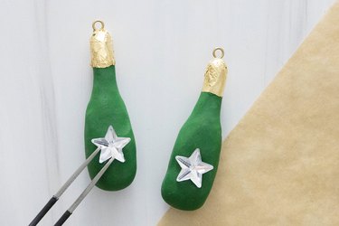 Clay champagne bottle pendants with star rhinestones