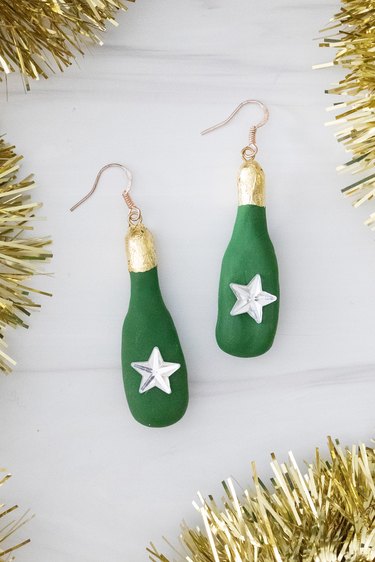 Clay champagne bottle earrings for New Year's Eve