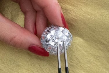 Glue rhinestones to foam ball for disco ball earrings