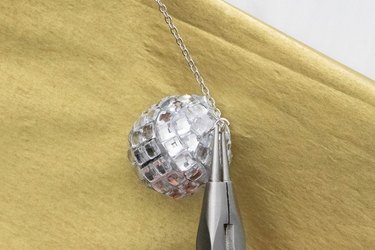 Attach mini disco ball charm to chain