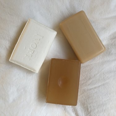 Three bars of soap in different colors