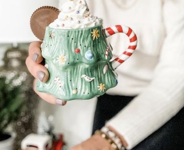 Christmas tree mug with candy cane handle.