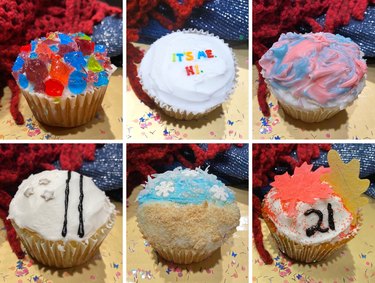 A collage of six Taylor-Swift-themed cupcakes set on a gold tray and surrounded by glitter.
