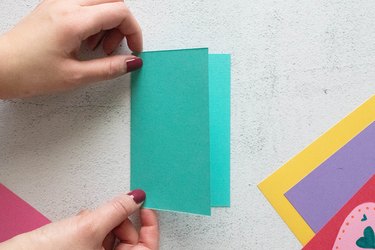 Turquoise paper folded in half