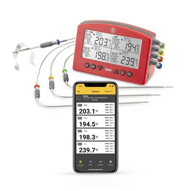 ThermoWorks Signals thermometer, and phone displaying mobile app, on a white ground