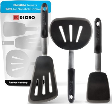 di Oro set of silicone spatulas on a white ground, with packaging displayed in the background