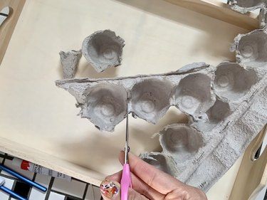 Cut the egg carton pieces to create flowers