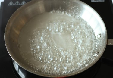 Boiling mixture of water and sugar