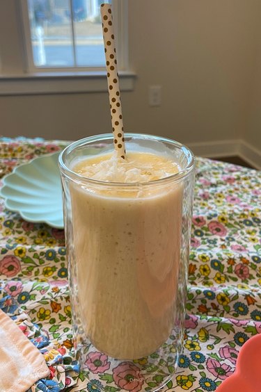 Mango coconut smoothie with straw