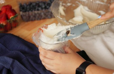 Transferring cream cheese filling to piping bag