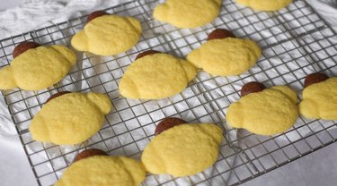 Baked Pompompurin cookies on a wire rack.