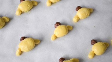 Lined baking tray with Pompompurin cookies.