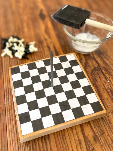 adhere chessboard to table with glue
