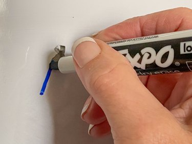 draw a dry-erase mark over the permanent marker