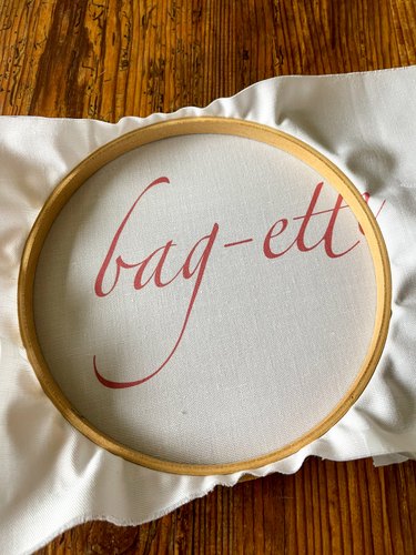 Put printed fabric inside embroidery hoop