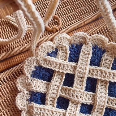 Crocheted bag shaped like a blueberry pie