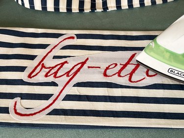 Press embroidery onto bag with an iron