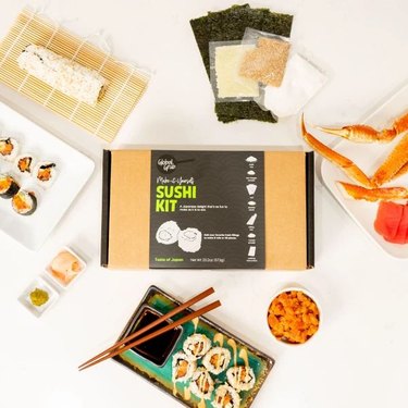 Overhead shot of sushi-making kit by Global Grub and sushi that was prepared using the kit.