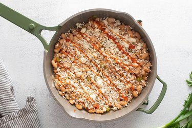 Buffalo-style beans topped with breadcrumbs, gorgonzola and sauce