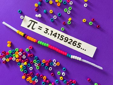 String beads on pipe cleaner to represent the digits of pi