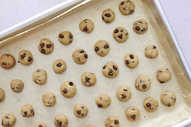 Baked mini cookies on a baking sheet