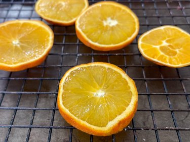 sliced oranges on a baking rack