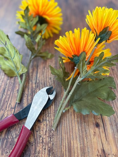 use wire cutters to clip the faux flowers to the proper length