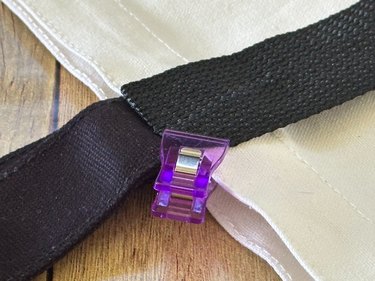 close-up of clipping straps to bag