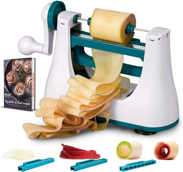 Besteely spiralizer/sheeter on a white ground, with insets of its extra blades and the accompanying cookbook