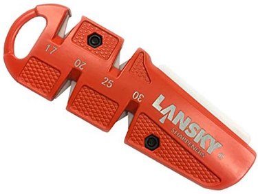 Orange Lansky pocket sharpener on a white ground