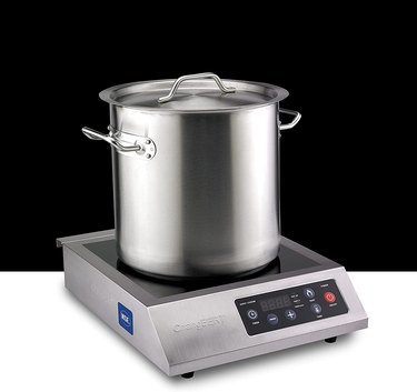 ChangBERT 240 volt commercial-style induction cooktop, pictured with a large pot against a black-and-white ground