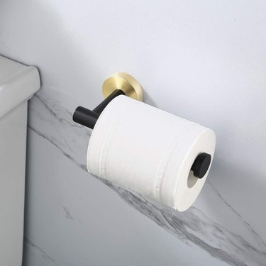 modern wall-mounted toilet paper holder in two tone finish