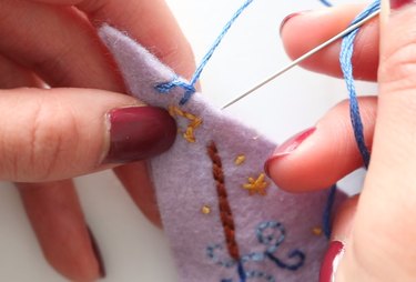 Pull the thread to create a blanket stitch