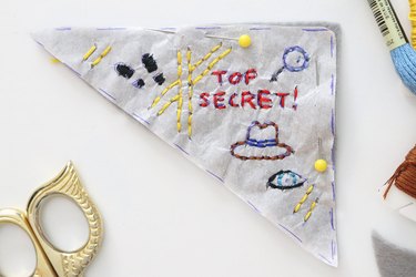 Mystery-themed embroidered corner bookmark