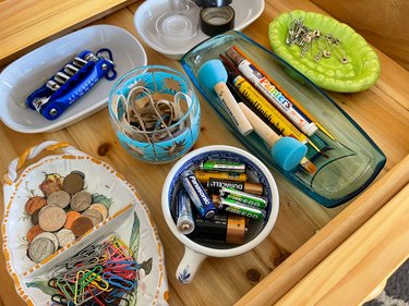 use cups and bowls to organize junk drawers