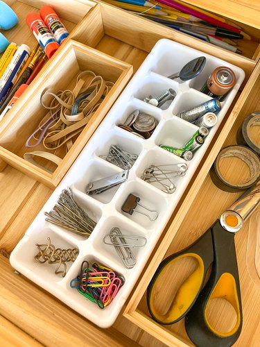 use ice cube trays to organize junk drawers