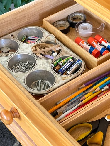 use muffin tins to organize junk drawere