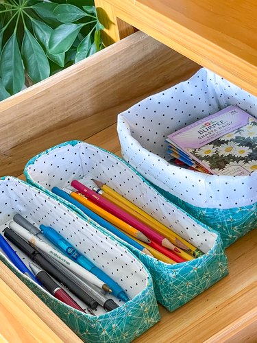 use fabric baskets to organize junk drawers