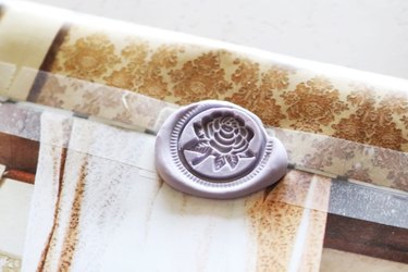 Closeup of wax seal on an upcycled envelope