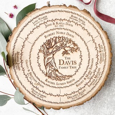 Circular wood slice engraved with "The Davis Family Tree"